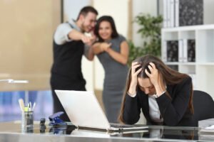 Businesspeople bullying a colleague at office